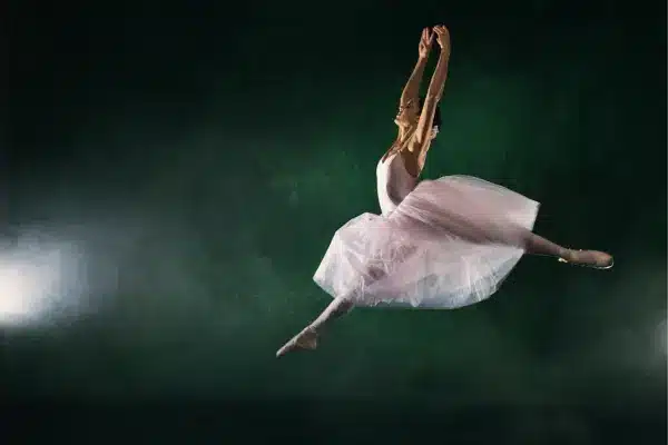 a ballet dancer midair used to represent the directive to support arts and entertainment by OTL Seat Fillers