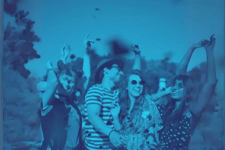 People laughing at outdoor festival, image with blue screen overlay.