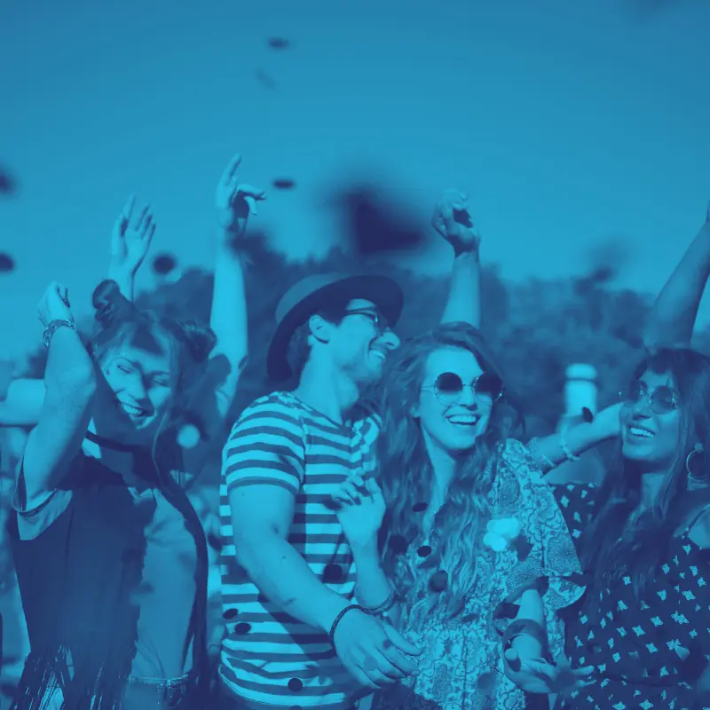 People laughing at outdoor festival, image with blue screen overlay.