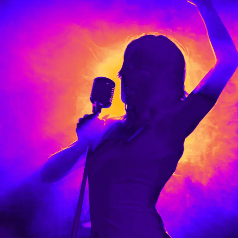 A neon colored silhouette of a singer with one hand on a mic and her other raised in the air