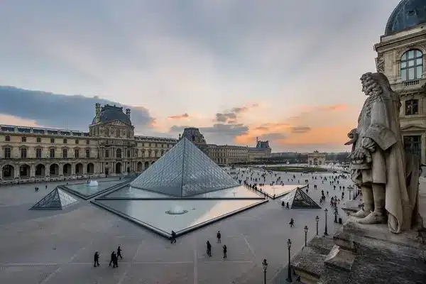Dusk settles over the Louvre Museum, inviting viewers to explore virtual tours of its galleries, where the marvels of art can be experienced in a VR setting, bringing culture to your doorstep.