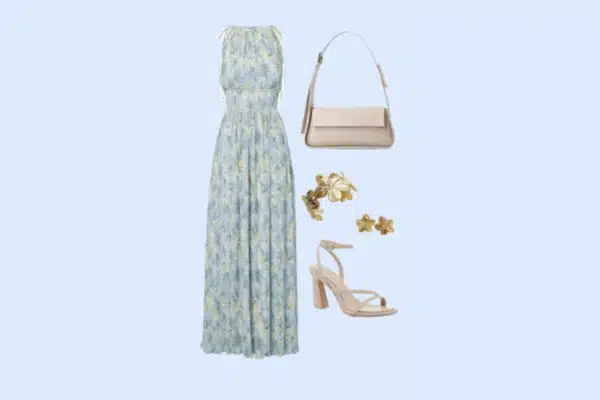 A light blue floral maxi dress paired with nude block-heeled sandals, a beige handbag, and gold floral earrings.