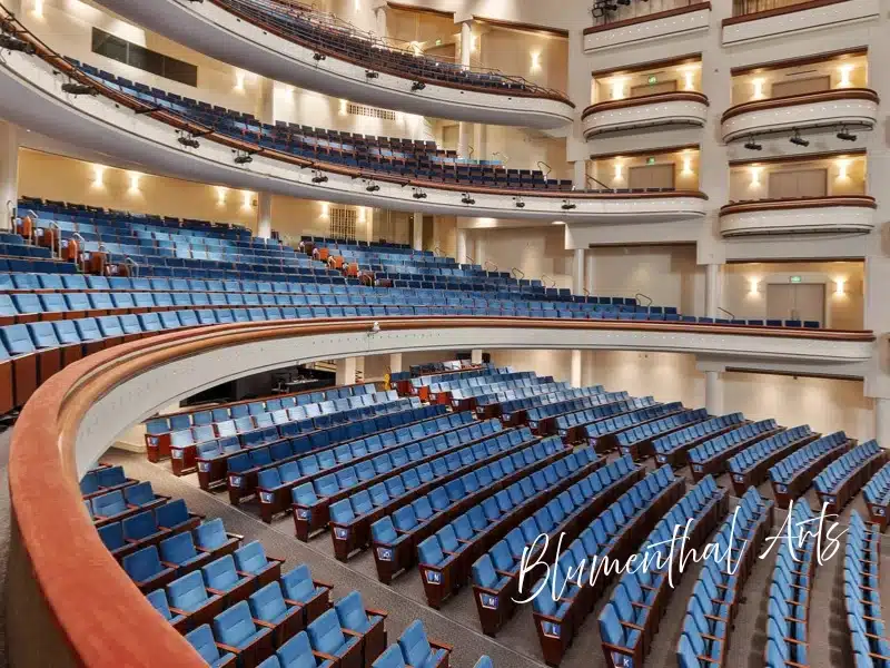 Blumenthal Performing Arts (Belk Theater) interior with blue seats and sweeping balconies — Charlotte experience gift idea.