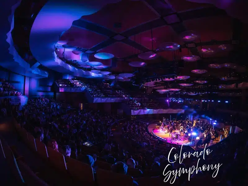 Colorado Symphony at Boettcher Concert Hall with purple stage lights—Denver experience gift idea.