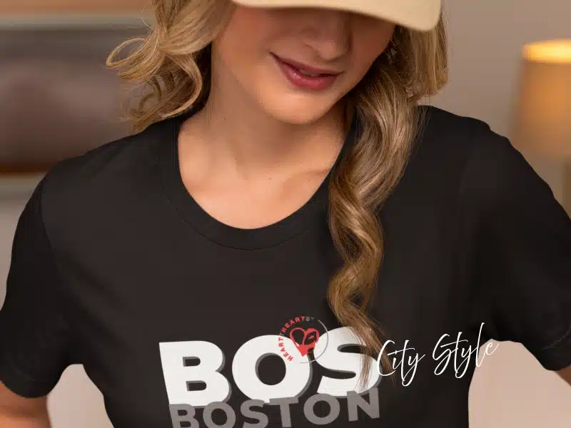 Person wearing black “BOS Boston” City Style T-shirt—Boston gifts & local merch idea.