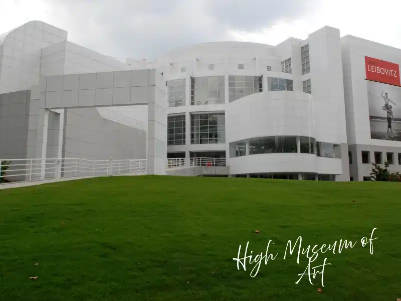 High Museum of Art, Midtown Atlanta, modern white building set behind a grassy slope.