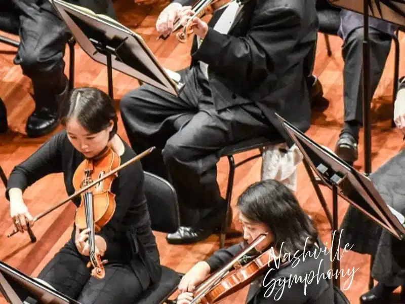 Nashville Symphony string musicians performing on stage—ideal Nashville experience gift idea.
