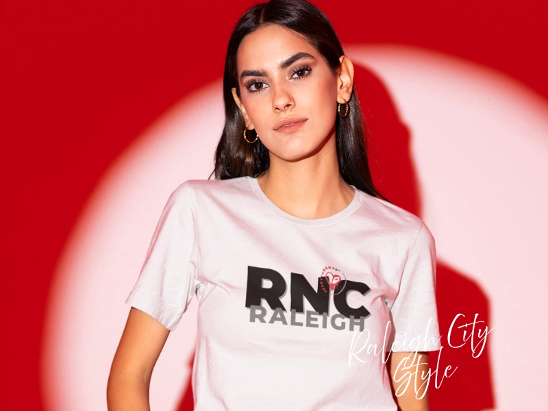 Model wearing Raleigh City Style tee with bold RNC Raleigh graphic, local apparel gift