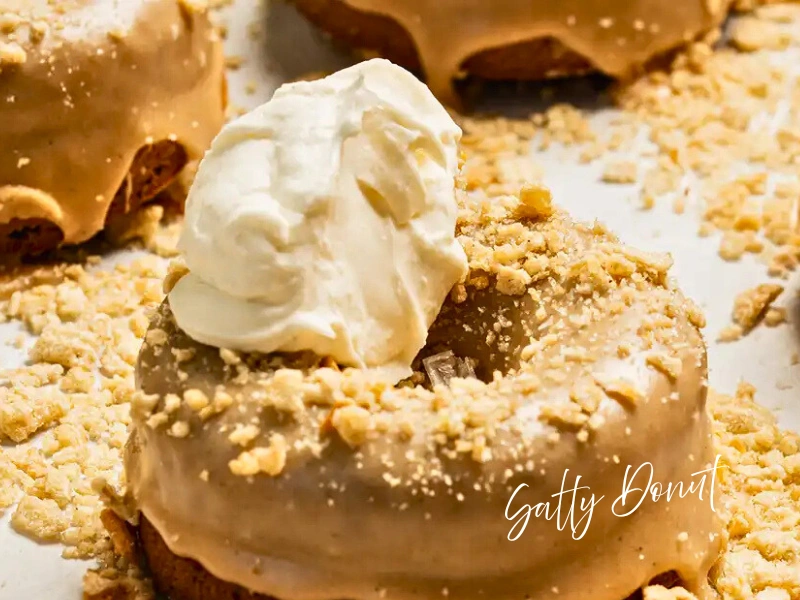 Close-up of Salty Donut topped with whipped cream and cookie crumble, Miami treat gift