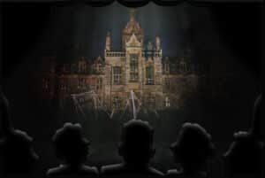 Audience glows from the spooky stage lights while the stage is filled with a creepy school