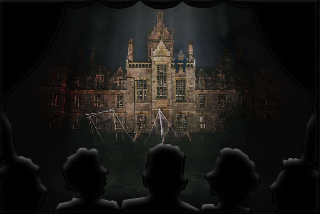 scene of theater audience glowing from the lights of the