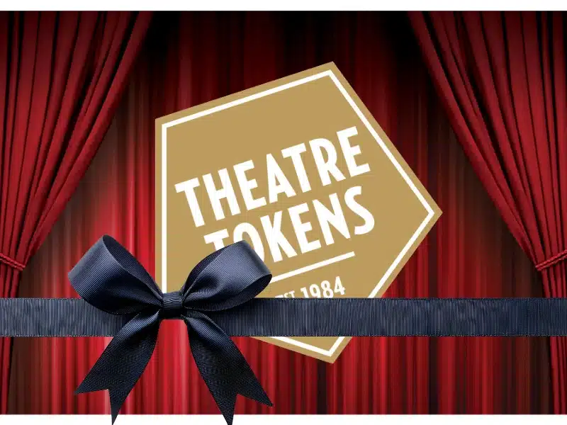 Theatre Tokens gift card between red curtains — flexible experience gift for theatre lovers (UK).