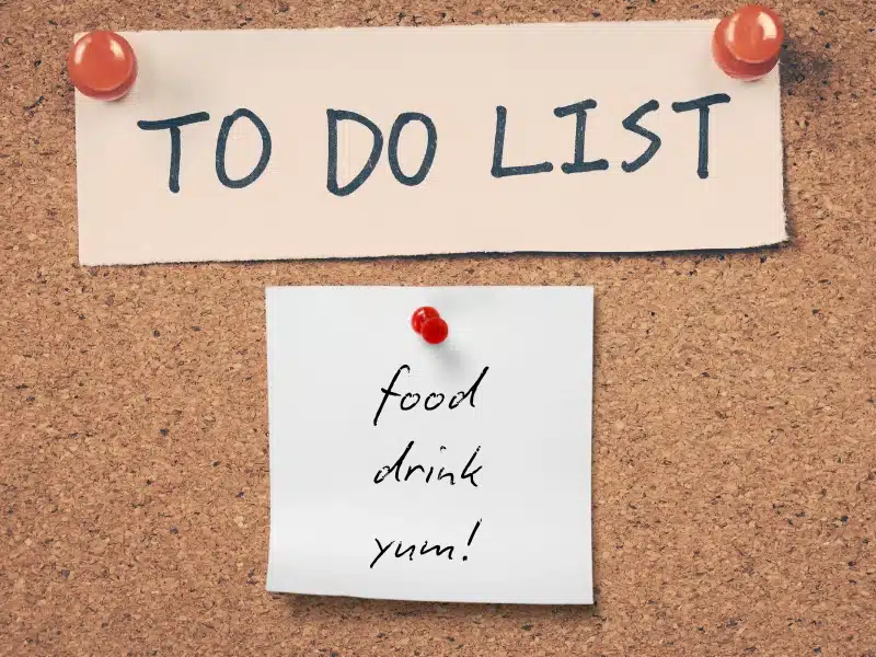 A "To Do List" on a corkboard with a sticky note that reads "Food, drink, yum!"