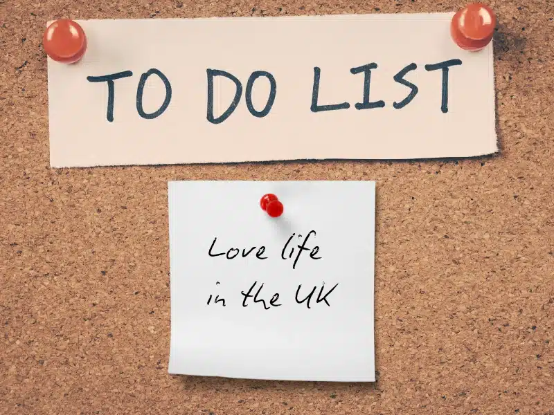 A "To Do List" on a corkboard with a sticky note that reads "Love life in the UK."
