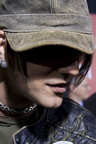 Criss Angel magician portrait wearing hat and leather jacket