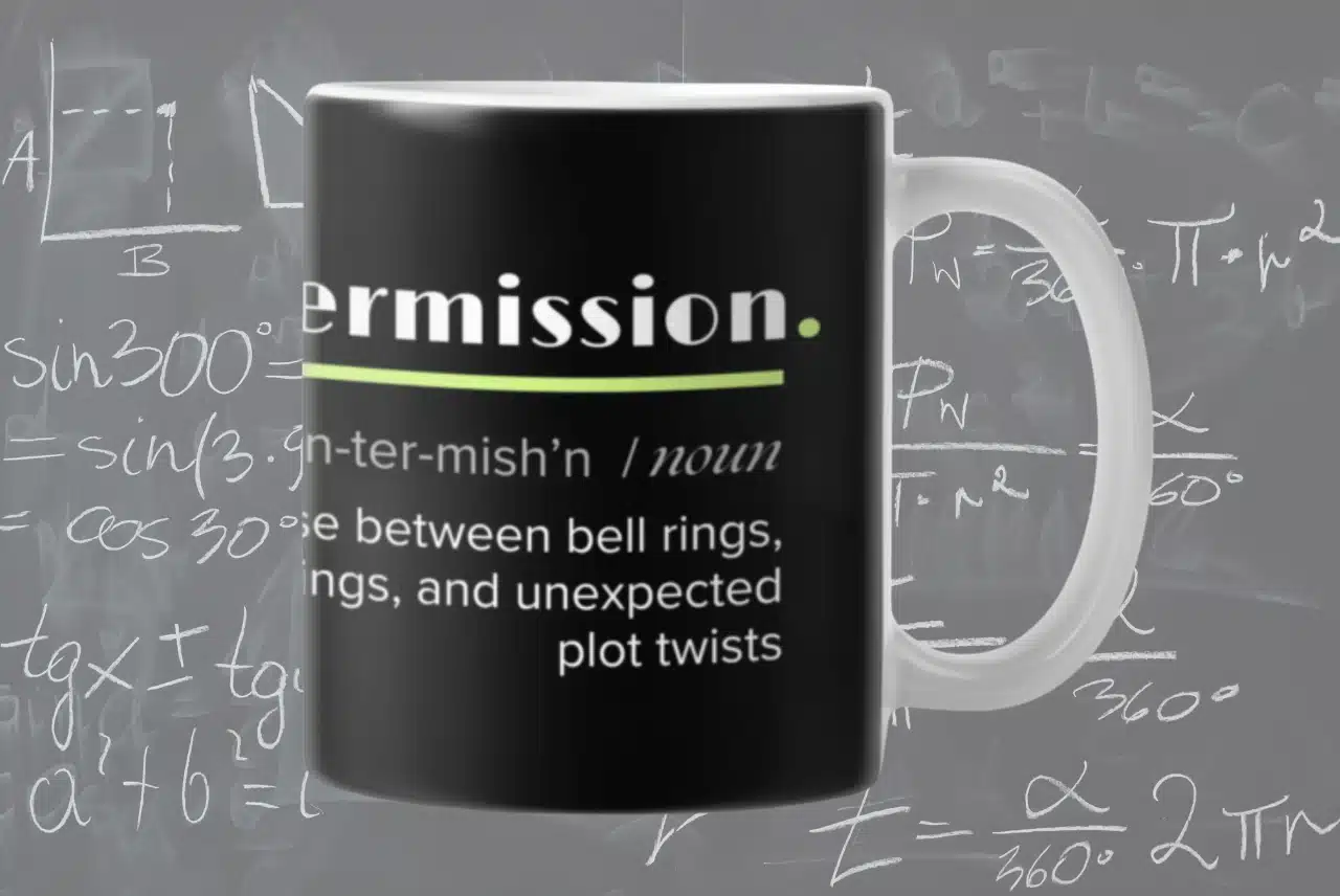 Life Needs Intermission Teacher Edition black mug with definition-style intermission text and classroom background.
