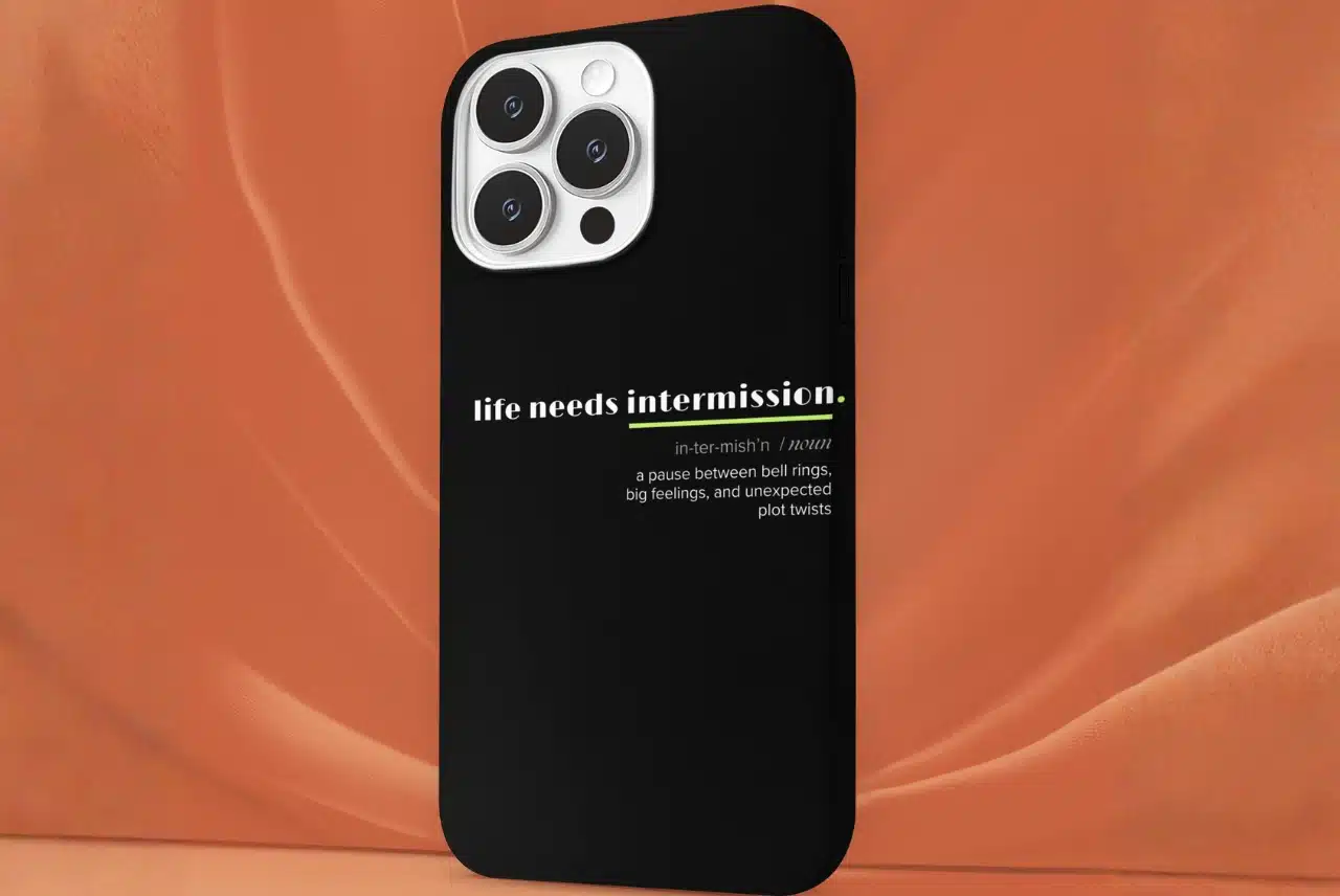 Life Needs Intermission Teacher Edition black phone case with green accent and classroom-inspired definition text.