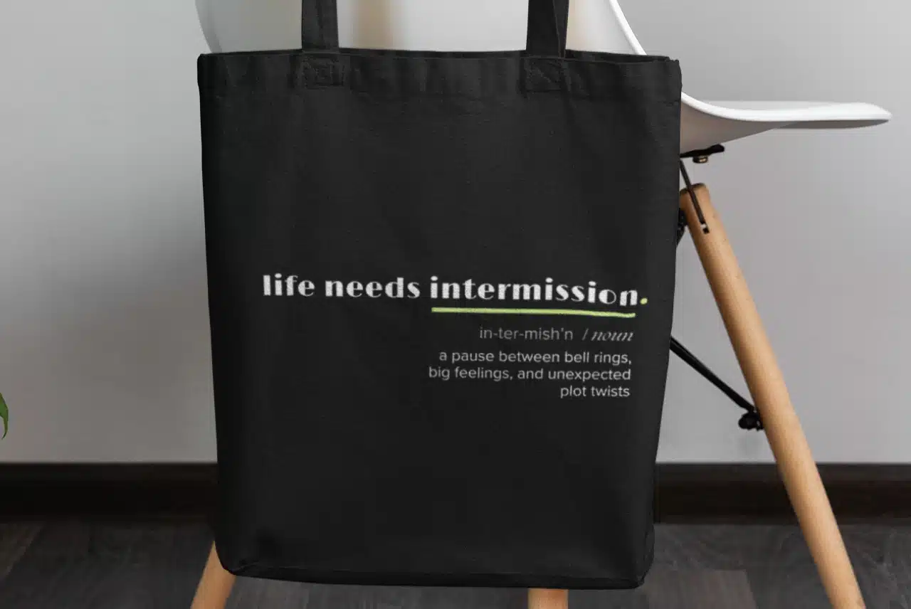 Life Needs Intermission Teacher Edition black tote bag with classroom-inspired definition text.