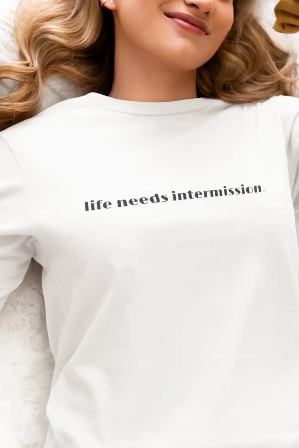 Life Needs Intermission light long sleeve t-shirt with black text on the front.