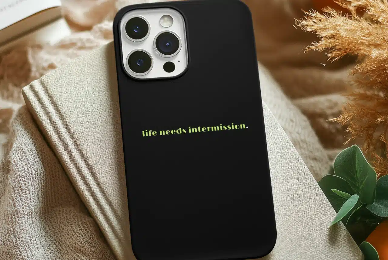 Life Needs Intermission phone case with the text design on the back.