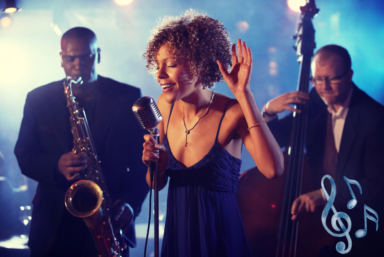 Jazz singer performing on stage with live band including saxophonist and upright bass player in a dimly lit club