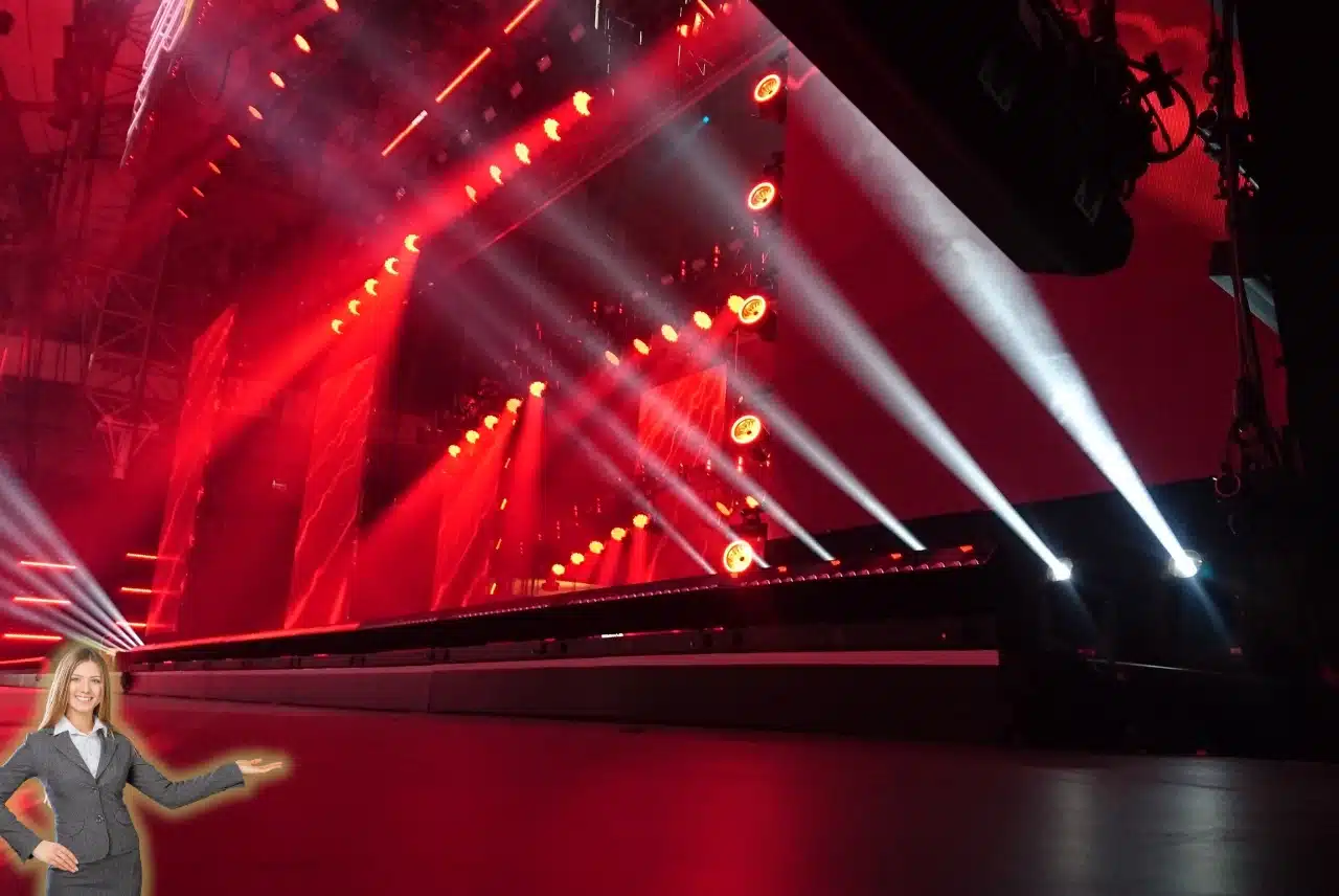 Live entertainment stage with dramatic red lighting and concert-style production setup